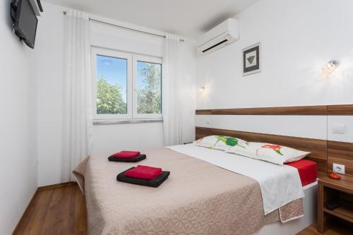 Posteľ alebo postele v izbe v ubytovaní Villa Krnica