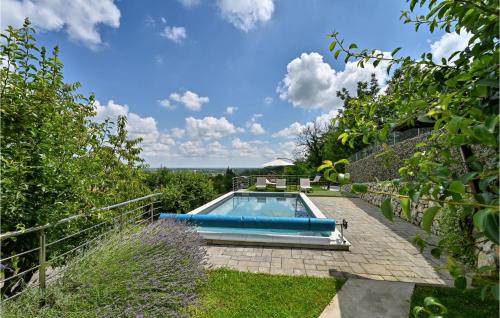 a swimming pool in the backyard of a house at 3 Bedroom Pet Friendly Home In Ludbreg in Ludbreg