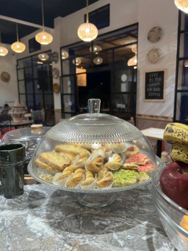 a tray of donuts and salad on a table at Tazart Lodge in Marrakech