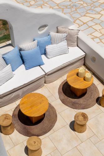 a white couch with pillows and tables on a boat at Villa Virginia in Ambelas