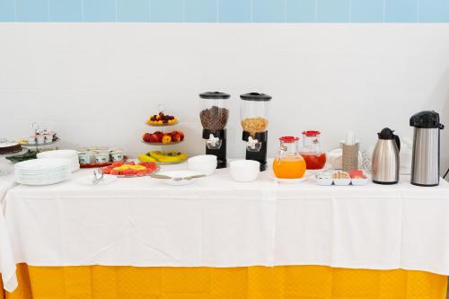 a table with food and drinks on it at Tenuta San Lorenzo in Otranto