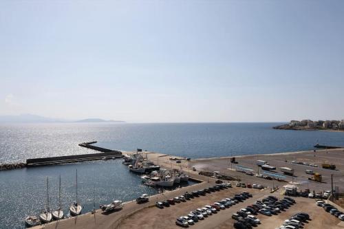 an aerial view of a marina with cars and boats at Το σπίτι δίπλα στη θάλασσα / The house by the sea in Rafina