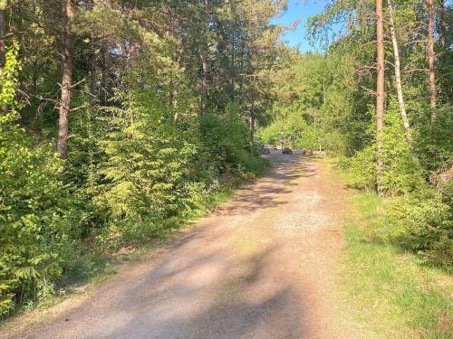 a dirt road in the middle of a forest at 6 person holiday home in SANDHULT-By Traum in Sandhult