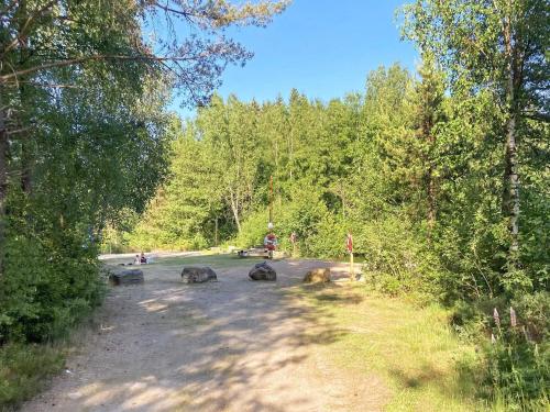 a group of animals on a road in the woods at 6 person holiday home in SANDHULT-By Traum in Sandhult