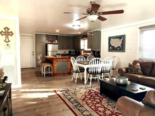 a living room with a couch and a table at Mae’s Cottage in the Clouds in Blue Ridge