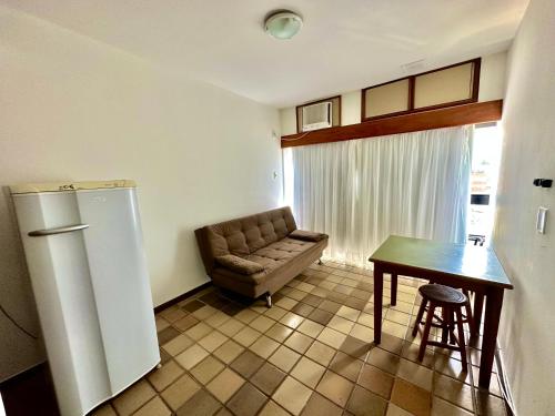 a living room with a couch and a table at Ondina Apart Hotel Residences in Salvador