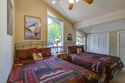 a bedroom with two beds and a window at Dillon Vacation Rental Hot Tub and Beautiful Views! in Dillon