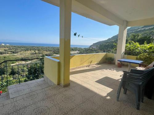 a porch of a house with a view of the ocean at Albert Guest House in Borsh