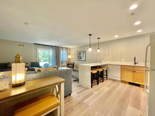 an open kitchen and living room with a couch at The Villages at Ocean Edge Resort & Golf Club in Brewster