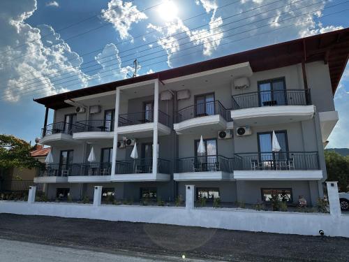 a building with balconies on the side of it at Thea comfy living in Nea Vrasna