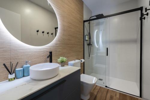 a bathroom with a sink and a shower at Marina Beach Apartments in Valencia