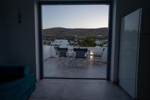 a view of a balcony with a table and chairs at Traditional White House 2 in Prodromos Paros