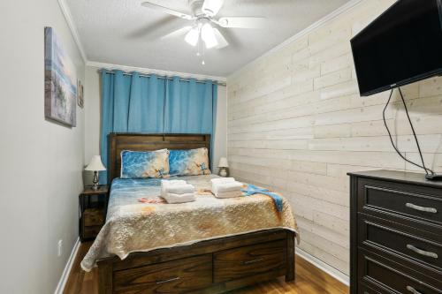 a bedroom with a bed with two towels on it at Hilton Head Vacation Rental Private Beach Access! in Hilton Head Island