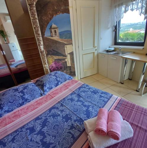a bedroom with a bed with two towels on it at Villa Maria in Opatija