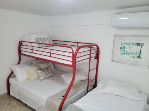 a couple of bunk beds in a room at Ocean Village at Combate in Cabo Rojo