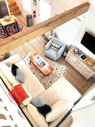 an overhead view of a living room with a couch and chair at Liz Lane Cottage- entire guesthouse in Charleston