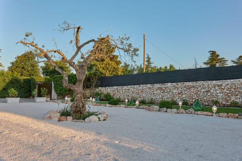 Taman di luar I Trulli di Cosimo Luxury