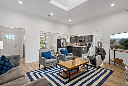 a living room with a couch and chairs and a table at Remodeled 4 Bedroom Home Close to Downtown Frisco. in Frisco