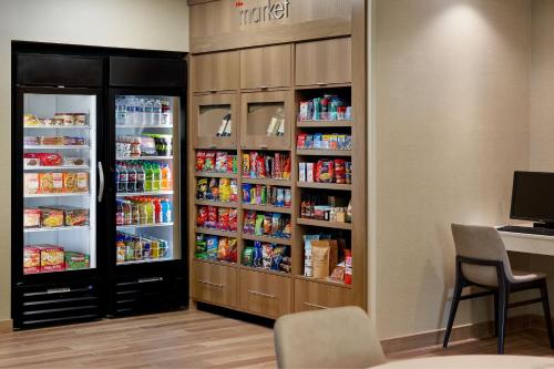 a room with two large refrigerators with food at Residence Inn Asheville Biltmore in Asheville