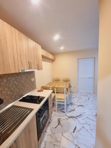 a kitchen with a stove and a counter top at Rental House Tale in Tale