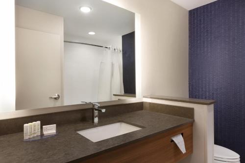 a bathroom with a sink and a toilet at Fairfield Inn & Suites by Marriott Boulder Longmont in Longmont