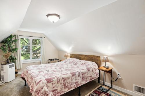 a bedroom with a bed and a window at Twin Peaks Vacation Rental with Hot Tub! in Twin Peaks
