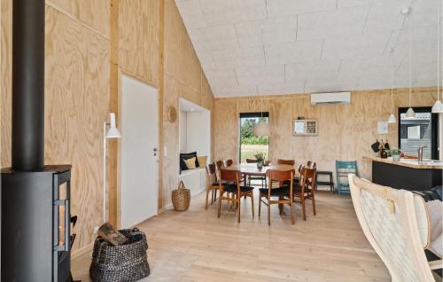 a kitchen and dining room with a table and chairs at Gorgeous Home In Grenaa With Kitchen in Brøndstrup