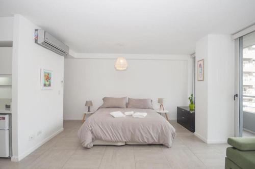 Postel nebo postele na pokoji v ubytování Libertador Complete Suite
