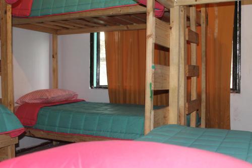 Ένα ή περισσότερα κρεβάτια σε δωμάτιο στο Hostel Posada de Gallo
