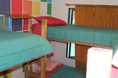 Ένα ή περισσότερα κρεβάτια σε δωμάτιο στο Hostel Posada de Gallo