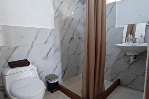 Koupelna v ubytování Mindomundo Home
