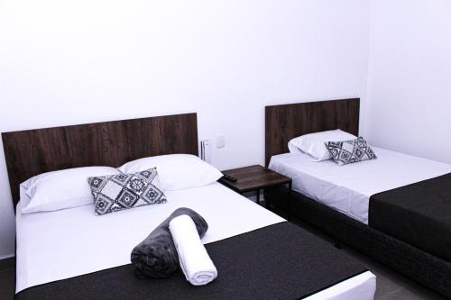 Postel nebo postele na pokoji v ubytování Ayenda Hotel MM