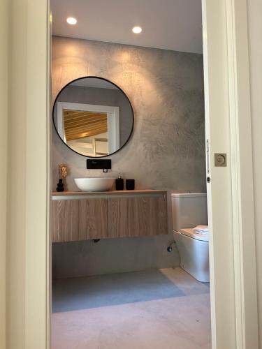 a bathroom with a sink and a mirror at Horta dos Cedros in Tomar