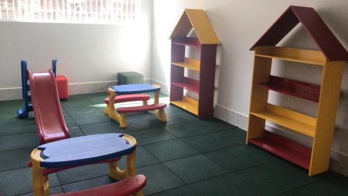 a room with colorful chairs and a shelf at SPAZZIO DI ROMA INCLUSO ACQUA PARK SPLASH in Caldas Novas