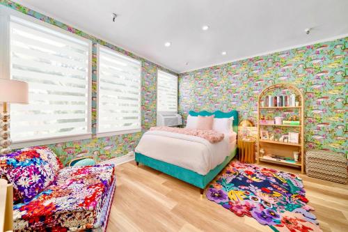 a childs bedroom with a bed and a chair at King Bed Mermaid suite - heart of Palm Beach, free parking included in Palm Beach
