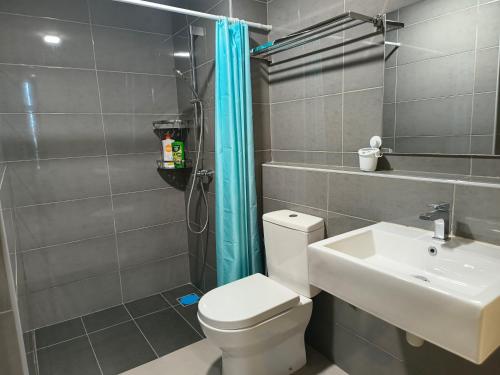 a bathroom with a toilet and a sink and a shower at Love De Sea 4pax 850sf 2R2B Imperium Residence in Kuantan