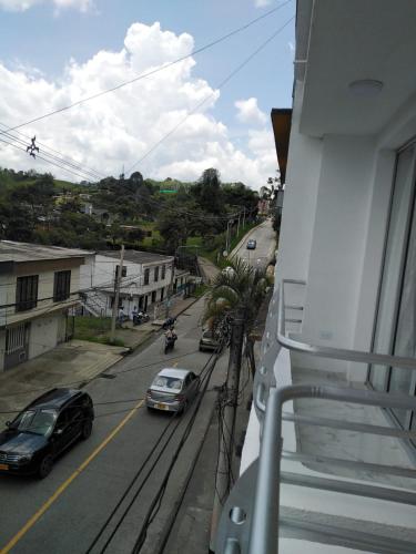 a view from a balcony of a street with cars at Apartamento Amoblado en la via Termales Santa Rosa de Cabal in Santa Rosa de Cabal