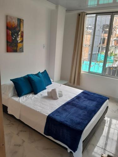 เตียงในห้องที่ Apartamento Amoblado en la via Termales Santa Rosa de Cabal