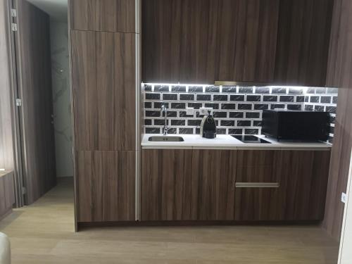 a kitchen with a sink and a counter at BrandApartments in Porto