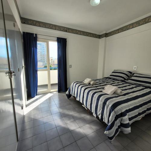 Giường trong phòng chung tại Un sueño en Salta