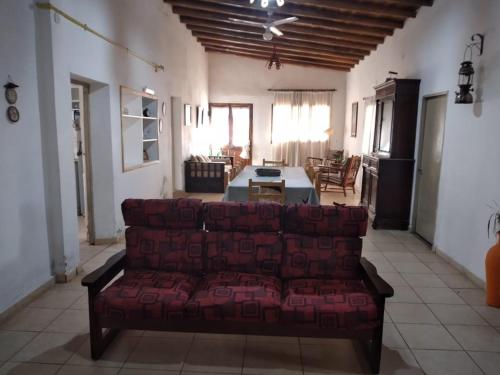 a living room with a couch and a table at Mama Maruja in San Luis