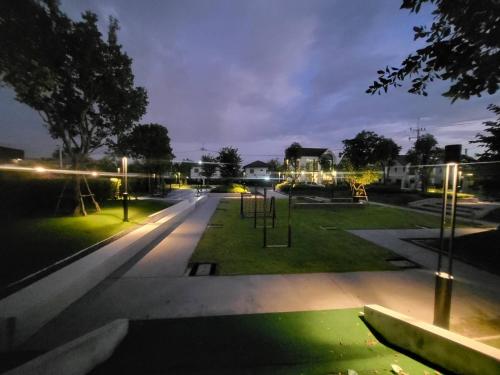 an empty park with a playground at night at MOST Family 456/66 Ubon-Thailand in Ubon Ratchathani