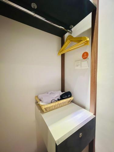 a room with a white counter with a shelf at oxy suites 1-03 at Shop House Meisterstadt Pollux Habibie in Batam Center
