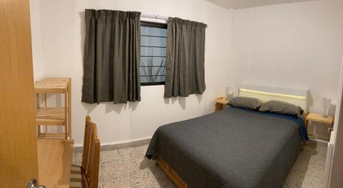 a bedroom with a bed and a window at Beds Friends Asis in Mexico City