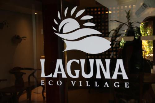 a sign for a restaurant with a white bird on the window at Family 2bd apt near Quepos/Manuel Antonio in Quepos