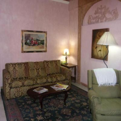 a living room with a couch and a chair at Casita Montana Hotel in Ajijic