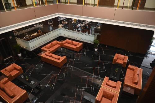 an overhead view of a lobby with couches and a bar at Effotel by Sayaji Sarola in Bhor