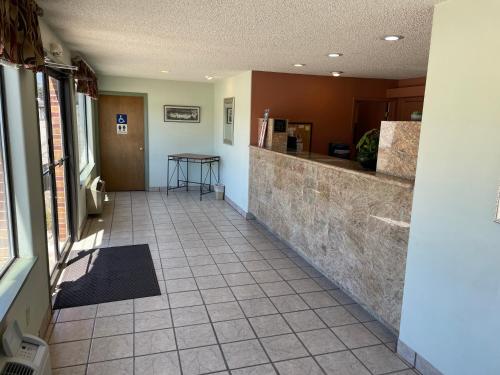 a hallway of a building with a counter and a table at Abajo Lodge in Monticello