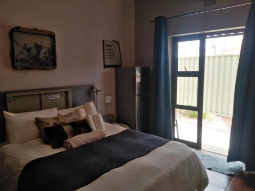 Кровать или кровати в номере Die Windpomp Guesthouse