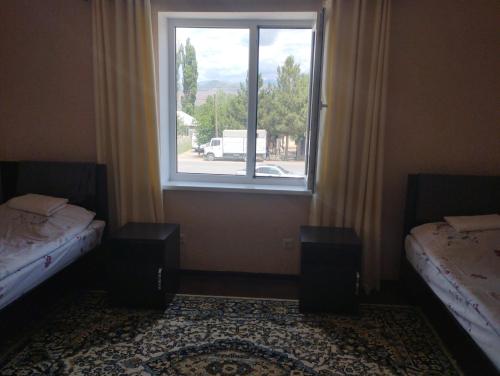 Ein Bett oder Betten in einem Zimmer der Unterkunft MALIKA Guest House